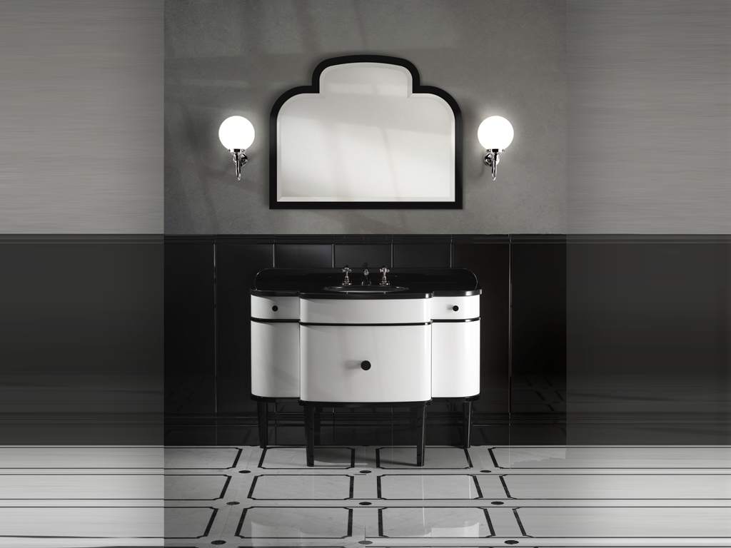 Devon&Devon. Raffinato specchio da parete in legno laccato lucido deep black e taglio a diamante, Music nasce abbinato al mobile porta lavabo, omonimo, dal quale riprende gli angoli arrotondati (dimensioni: cm. 100x80x4h).