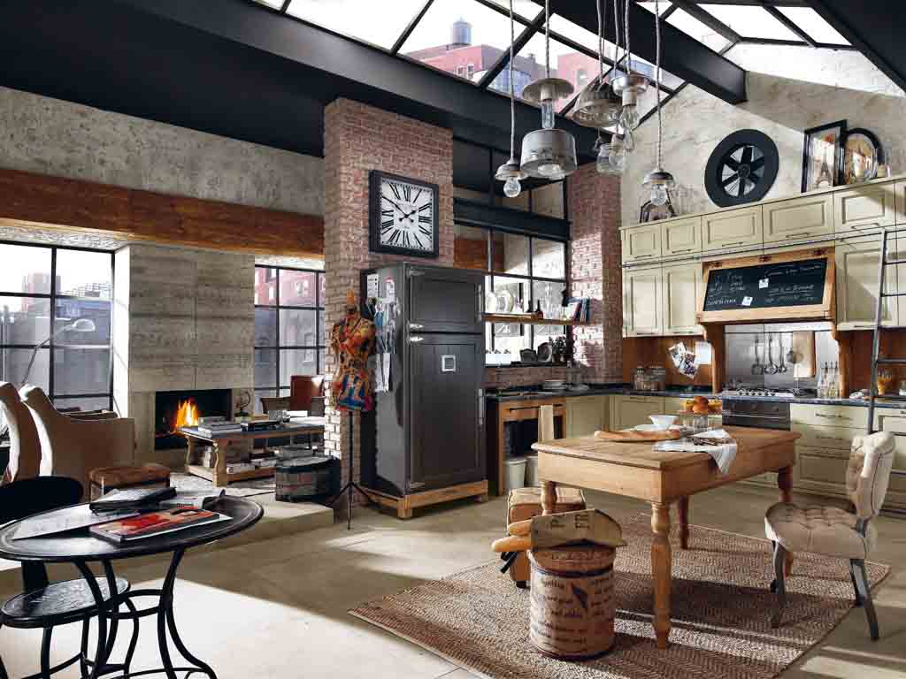 Marchi Group. Cucina Nolita. Realizzata in legno di castagno laccato in varie tonalità. Particolari gli elementi centrali con inserti in lavagna, utilizzati come cappa e contenitore. I piani top sono in marmo o in cemento.