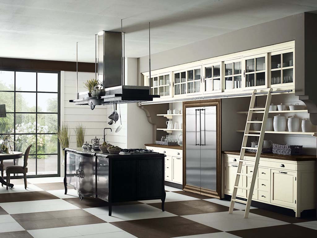 Marchi Group. Cucina Opera'. Il legno è il vero protagonista. Passato e presente che convivono con lo splendido lavello scavato in un unico blocco di pietra naturale.