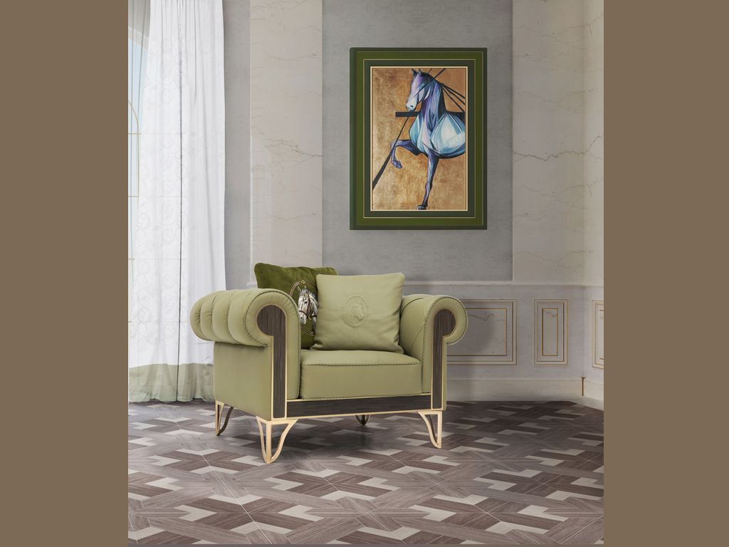 Formitalia. Granada, poltrona. Il rivestimento è in pelle Vogue Jade e lo schienale è trapuntato. I piedini in ottone color oro matt.