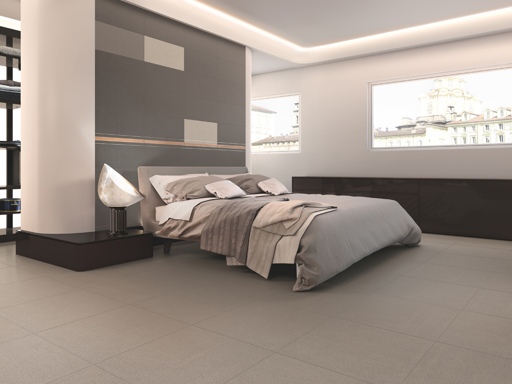 Casalgrande Padana. Earth by Pininfarina. L'originalità della collezione è la combinazione di lastre ceramiche con una serie di elementi di decoro ricchi di suggestioni, che rimandano alle streamline cars. Nell'immagine: Tortora 2, Tortora 4, Bianco, Line, Listello Daniela Silver.
