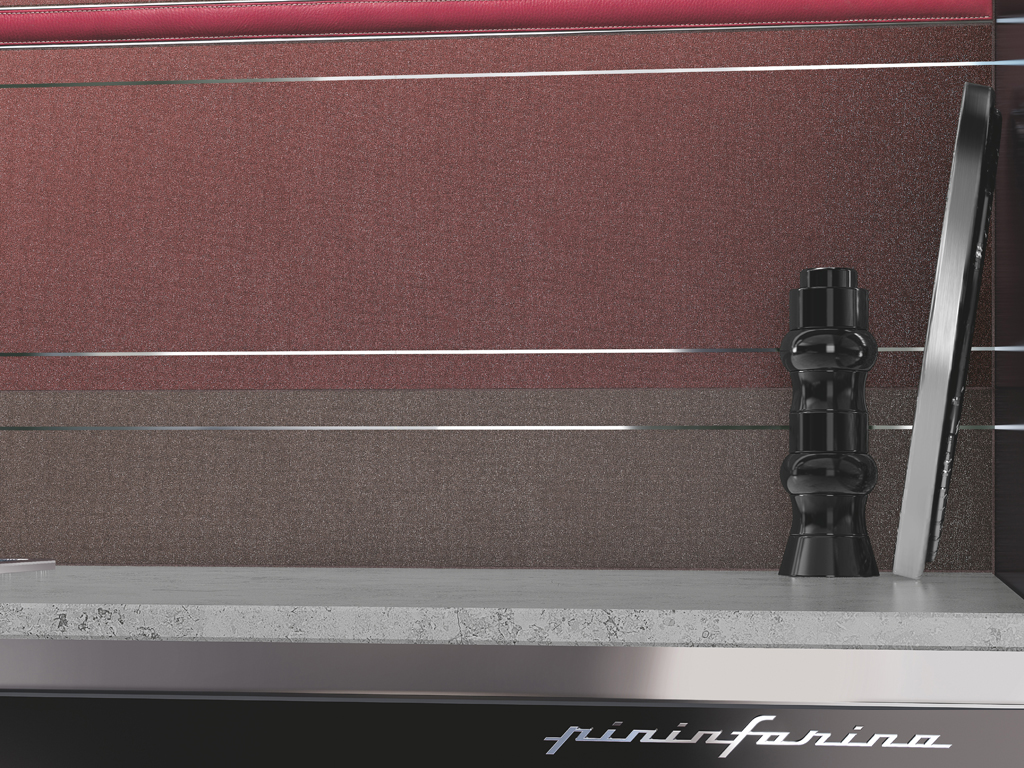 Casalgrande Padana. Earth by Pininfarina. Dettaglio della piastrella in grès porcellanato. Dalla lunga tradizione automobilistica di Pininfarina, linee pulite e eleganti, resi unici dall'utilizzo di finiture e materiali speciali. Nell'immagine: Brunello, Metalred, Line, Listello Rojo Chrome. Possibilità di griffare il rivestimento, applicando il logo Pininfarina, sia sulla piastrella sia sul decoro.