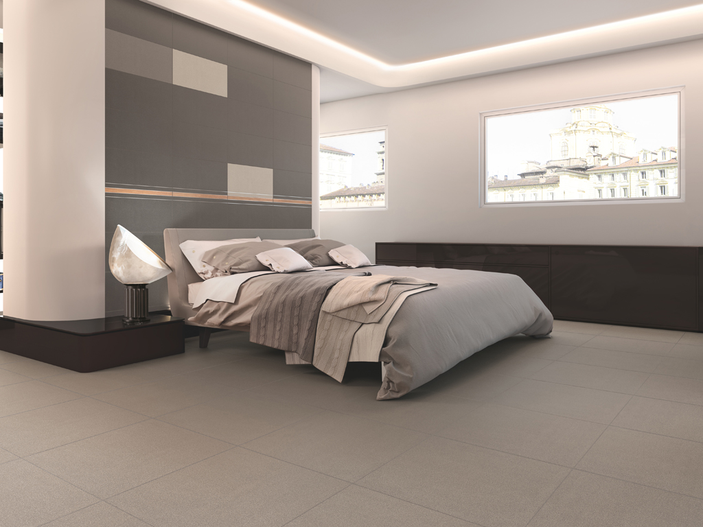 Casalgrande Padana. “Earth” by Pininfarina. L'originalità della collezione è la combinazione di lastre in grès porcellanato con una serie di elementi di decoro ricchi di suggestioni, che rimandano alle streamline cars. Degli autentici dettagli sartoriali. Nell'immagine: Tortora 2, Tortora 4, Bianco, Line, Listello Daniela Silver.