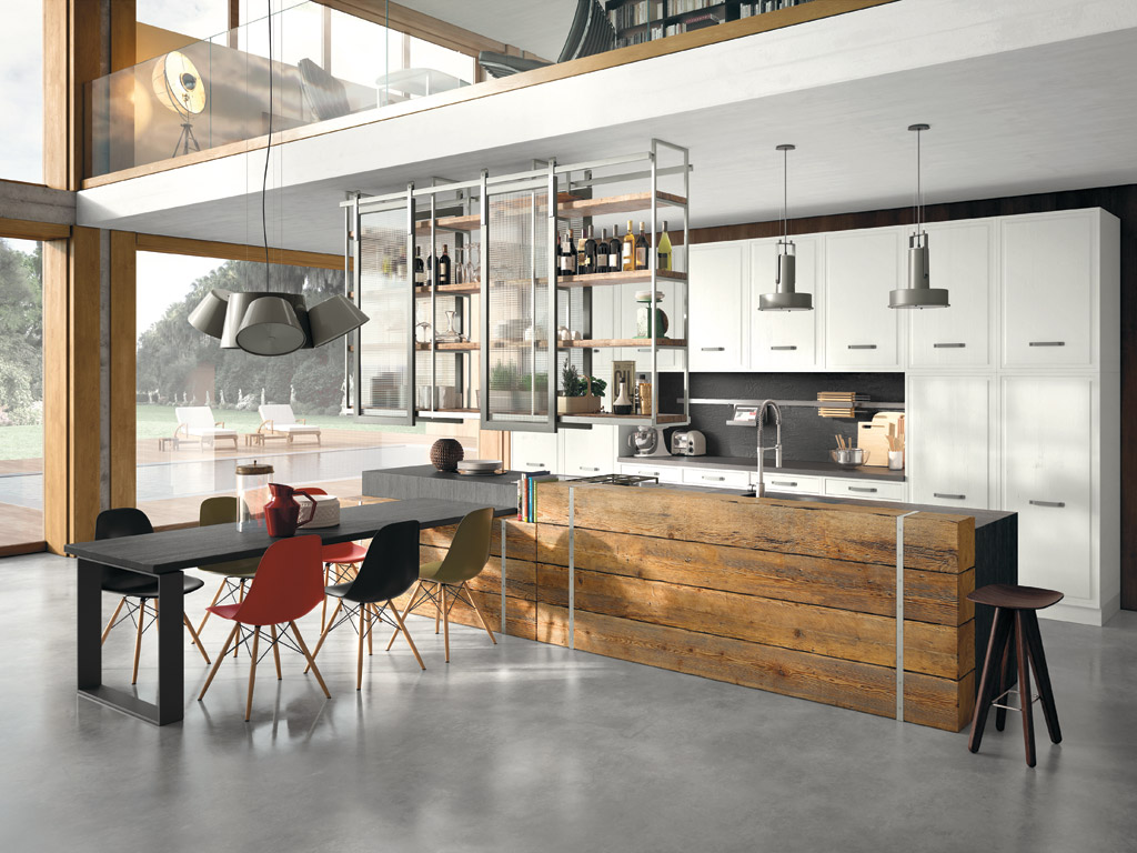 Marchi Cucine. Collezione Gusto Italiano. Il modello Brera 76 infonde, da subito, un’atmosfera “fissuta”. Il top in cemento abbinato al legno vecchio del bancone e il connubio vetro e acciaio, che compongono la struttura pensile, danno vita ad un lifestyle da industrial mood.
