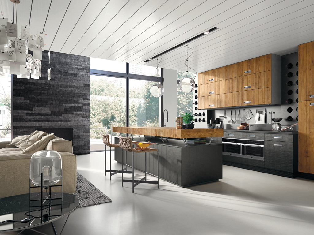 Marchi Cucine. Collezione Gusto Italiano. Il modello Lab 40 è una cucina dal forte effetto scenico. Si adatta alle differenti esigenze abitative giocando su arditi contrasti materici. Il legno vecchio ricopre il top dell’isola centrale mentre il legno di Conifera verniciato, riveste le ante. La cucina è disponibile in tre varianti colore: bianco puro, rosso grintoso e lavagna vintage mentre le ante in sei colori.