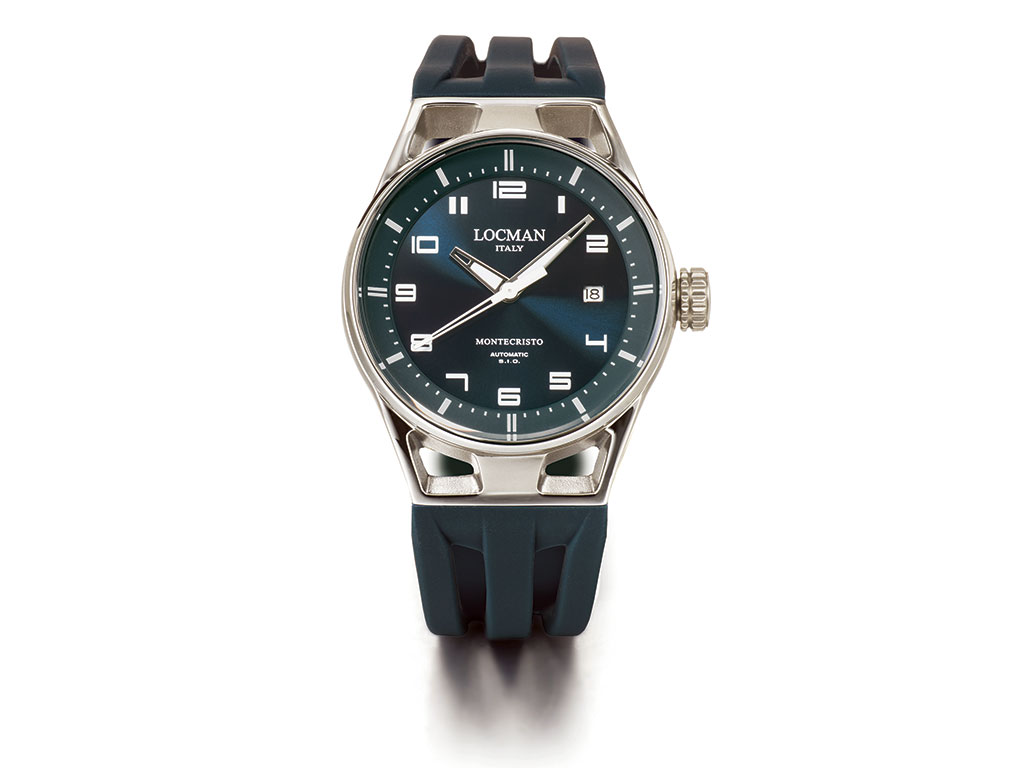 Locman Orologi. Modello Montecristo 41mm. La nuova versione dell’iconico orologio del brand elbano, con 41mm il design si fa più morbido e ancor più funzionale con le tipiche anse a tre barre che nel 41 mm formano un solo blocco con la cassa, aumentando notevolmente la stabilità dell’orologio. Le dimensioni della cassa si riducono notevolmente, passando dai 44 mm ai 41 mm di diametro, in linea con la tendenza alle misure più contenute. Montecristo 41 mm è proposto con meccanismo cronografo al quarzo o con movimento meccanico solo tempo con carica automatica (nell’immagine) elaborato dalla Scuola Italiana di Orologeria, osservabile da un oblò di cristallo posto sul fondo in titanio. L’impermeabilità è garantita a 100 metri. Il cinturino è proposto in silicone anallergico, per le occasioni più sportive, o in pelle naturale, sempre con fibbia deplorante.