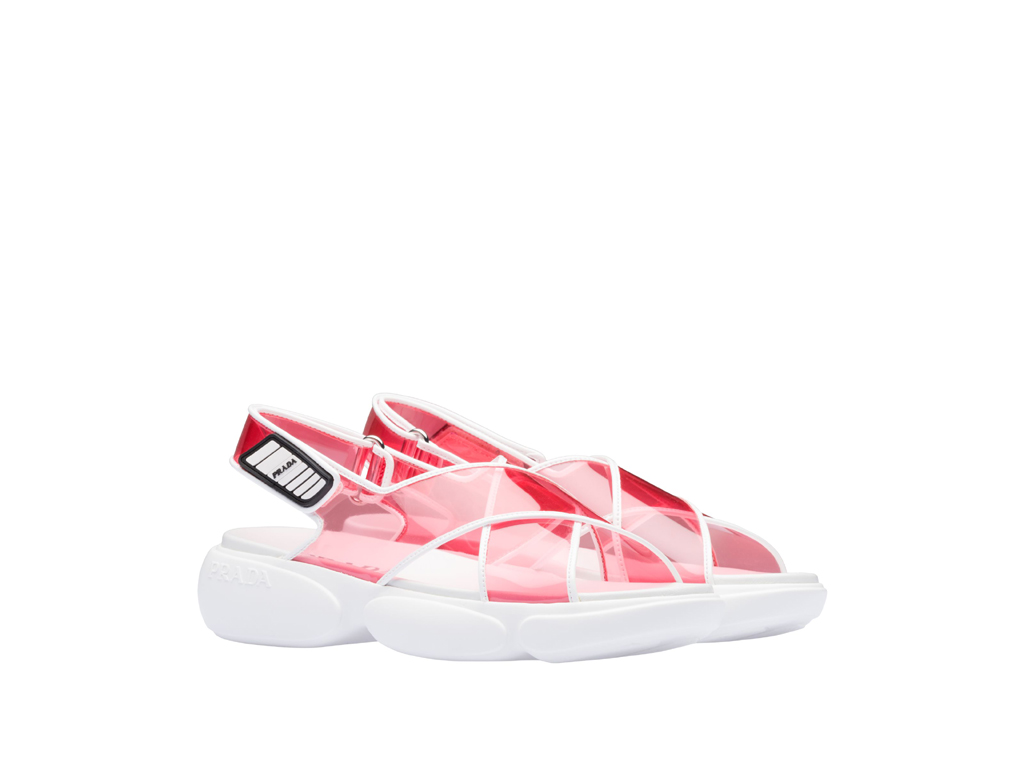 Prada. Sandali “Cloudbust”. Design originale, iconica suola in gomma, linea minimale per la tomaia in PVC definita da chiusure a strappo legate.