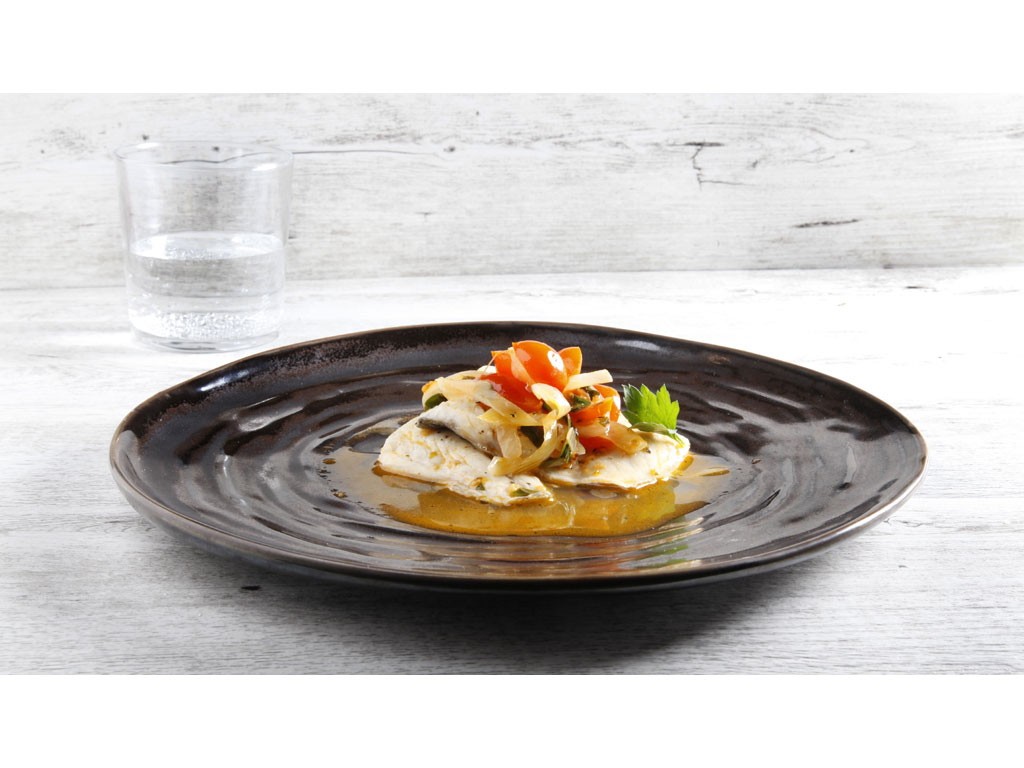 Dal ricettario Culligan “Filetto di branzino all’acqua pazza ai profumi mediterranei” realizzato dallo Chef Luca Malacrida.