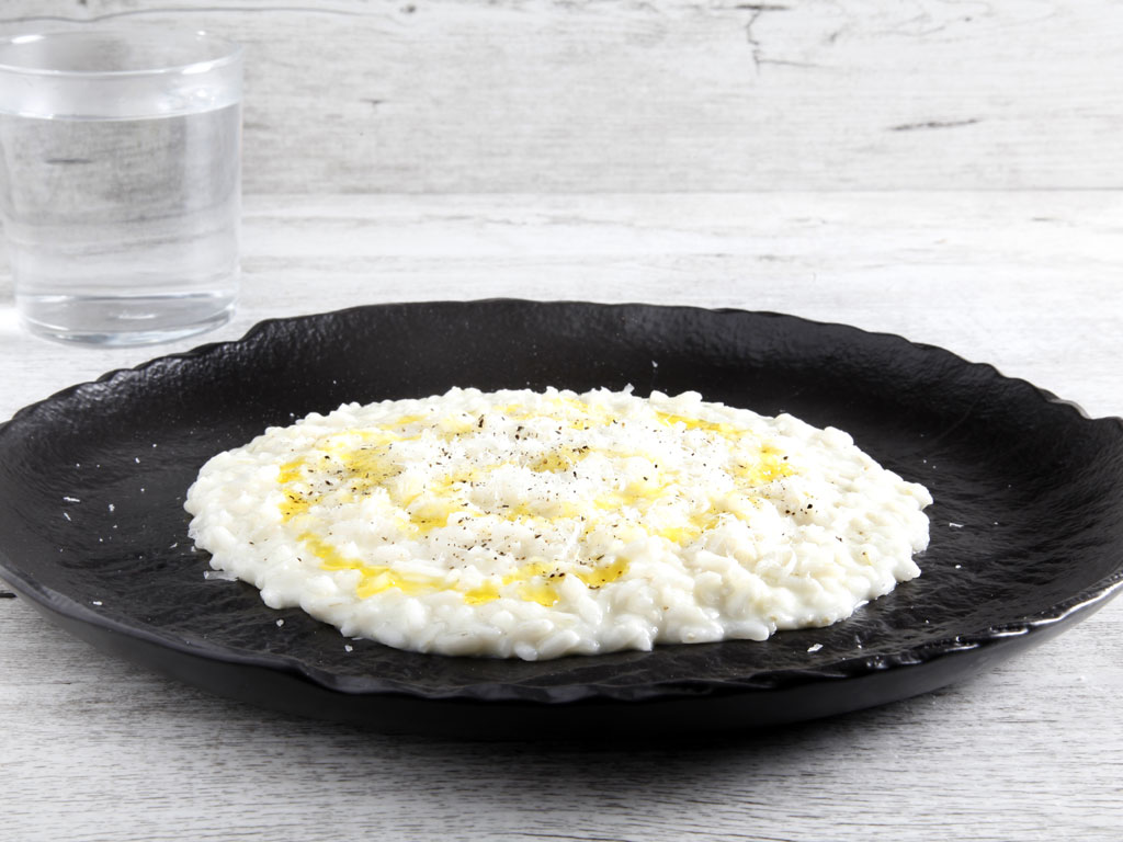 Dal ricettario Culligan “Risotto cacio e pepe con burro di mandorla” realizzato dallo Chef Luca Malacrida.