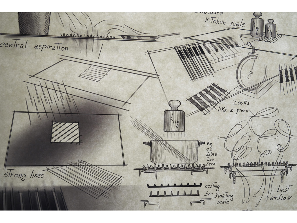 Elica. Nel disegno “NikolaTesla Libra”. In evidenza la griglia in ghisa che cela bilancia e cuore aspirante. Rimuovendola, si ha la possibilità di estrarre i filtri odore - grazie al sistema brevettato da Elica - e il filtro grassi per pulirlo e manutenerlo. (photo Marco Scarpa)
