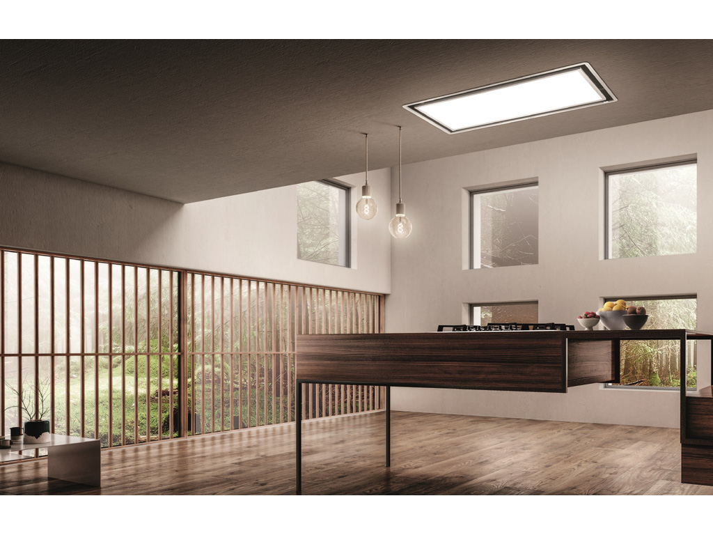 Elica. È la luce l'elemento che caratterizza la cappa a soffitto Skydome. Un grande pannello di 1 mt di lunghezza, grazie ad un sistema di illuminazione full led restituisce luce diffusa e uniforme. L’aspirazione perimetrale garantisce un'elevata capacità di captazione dei fumi oltre che una completa integrazione del prodotto nel controsoffitto dove è inserita la parte funzionale. Disponibile in due altezze, 16 o 30 cm, è adatta all’installazione in controsoffitti di diverse altezze. Completa la gamma la versione con motore remoto che permette di avere l’unità aspirante in posizioni differenti o esterne all’abitazione. Tutti i modelli sono in versione aspirante, ma possono essere installati in modalità filtrante attraverso l’integrazione degli accessori filtri e griglie ricircolo aria. I sistemi dimmer e tune-white permettono di regolare l'intensità della luce e di modificare la temperatura di colore per avere luce calda o fredda a seconda del mood che si desidera creare. Skydome è dotata del sistema brevettato Super Easy Installation che rende l’operazione di installazione facile e veloce. Disponibili accessori luce che rendono il sistema illuminante completo e personalizzabile.