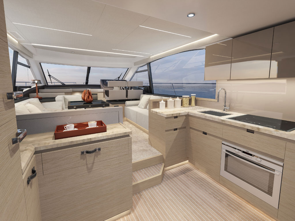 Bénéteau. Modello Monte Carlo 52. Il salone. Ampio spazio conviviale, area cucina collegata al pozzetto e postazione di guida rialzata. Protagoniste le ampie vetrate che regalano una visuale del mare a 360°. La visuale da poppa verso prua.