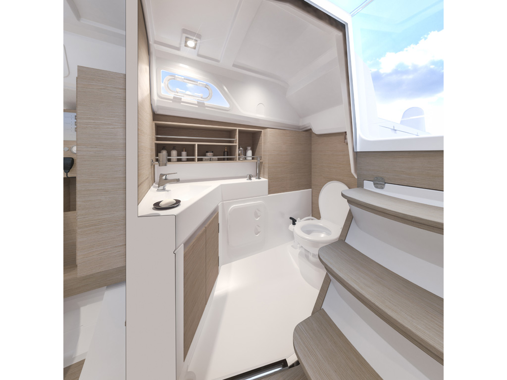 Bénéteau. Oceanis 30.1. Ai piedi della discesa dolce (3 gradini a 33°) sulla destra il grande bagno che si divide tra wc da un lato e doccia-vasca dall’altro.
