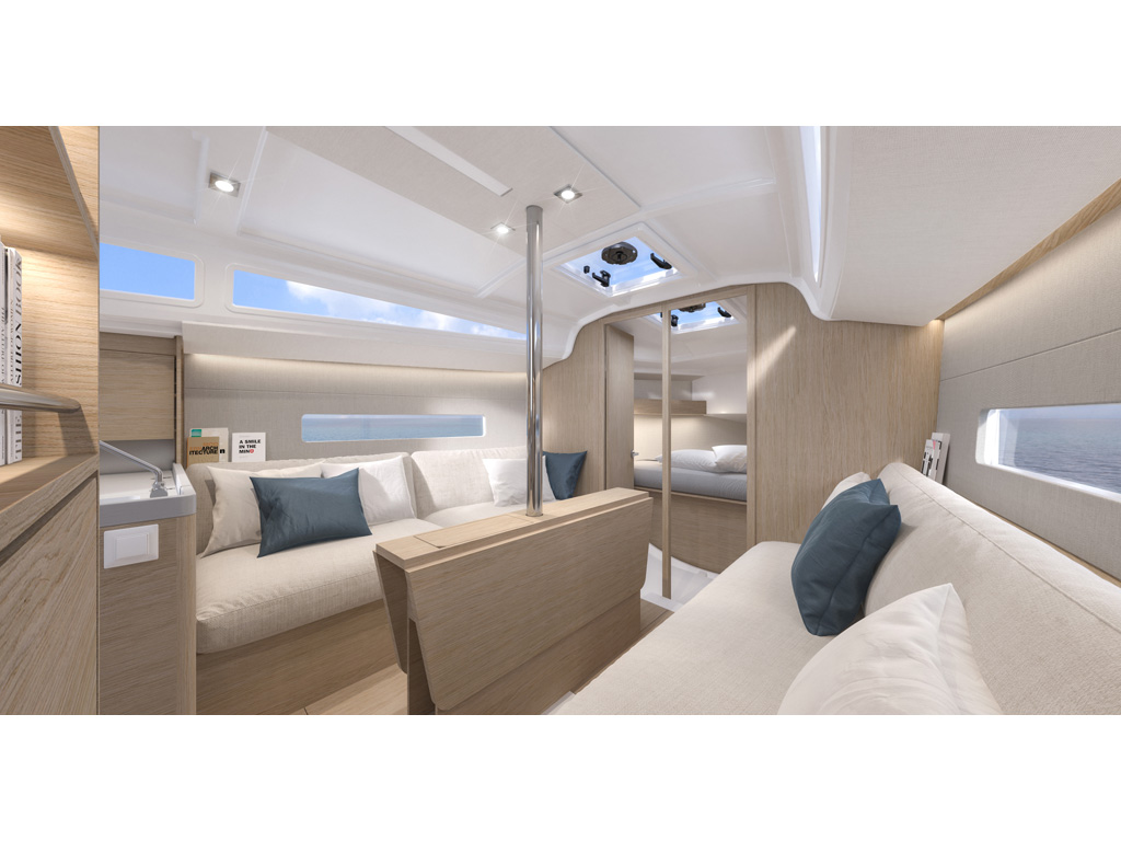 Bénéteau. Oceanis 30.1. Il quadrato. I due divani da due metri ciascuno aggiungono due cuccette supplementari. La parte centrale interna della barca in altezza raggiunge il metro e 98. Nell’immagine la visuale verso prua.