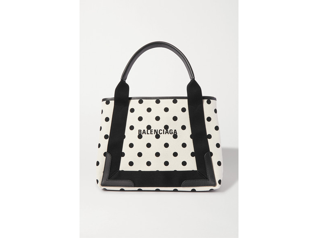 Balenciaga. Questa tote bag è stata realizzata in Italia con tela écru stampata e rinforzata con finiture in pelle.
