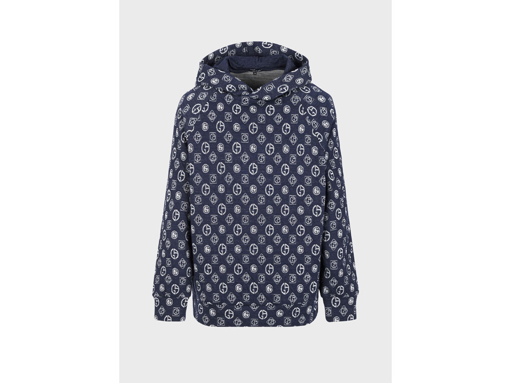 Giorgio Armani. Felpa dalla vestibilità over, con manica lunga, realizzata in denim jacquard con logo allover. Cappuccio e profili elasticizzati. Prezzo: euro 990,00.