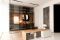Cabina armadio free standing all ingresso dello showroom Albed a Milano. Illuminazione: Martinelli Luce