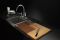 Cut&Connect, della collezione Cook&Connect. Disegnato da Studio Lievito e realizzato da Officinanove. Tagliere in legno composto da quattro moduli dedicati alla lavorazione di differenti alimenti:  frassino per la carne; rovere per il pesce; noce canaletto per le verdure e niangon per i formaggi.