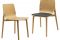 Alias. Kayak by Patrick Norguet. Sedia impilabile con struttura in legno massello di rovere o faggio con schienale in multistrato curvato di rovere o faggio. Nell'immagine anche la versione con cuscino incollato, rivestito in tessuto. Finitura in legno verniciato trasparente, tinto o con laccatura a poro aperto in vari colori.