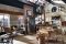 Marchi Group. Cucina Nolita. Realizzata in legno di castagno laccato in varie tonalità. Particolari gli elementi centrali con inserti in lavagna, utilizzati come cappa e contenitore. I piani top sono in marmo o in cemento.