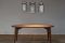 TheChicFish. Tavolo Ovale Vintage, in legno massello di mogano, design anni '70. Il piano è un mix di essenze legnose. Progetto dell'architetto Antonio Candussio (Euro 2.600). Sovrasta il tavolo la Lampada Latte. I contenitori di latte originali sono dei primi del Novecento (Euro 190.00).
