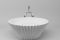 Park Avenue. Linea Junior. Vasca Cake. Un bagno davvero esclusivo ed unico è quello che Park Avenue dedica ai bambini e solamente a loro. Una vasca forma di delizioso pirottino per muffin, pura nelle forme e mossa dalla plissettatura dell'esterno, è bianca ed ha il gruppo vasca con doccia esterno in acciaio cromato. I pomellini dei rubinetti sono a forma di caramella. Design: Paolo Funghi Architetto.