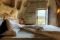 Sextantio Albergo Diffuso Le grotte della Civita. Grotta 13 Executive Suite. E' la suite nuziale. 80mq. sviluppati su più livelli.  La vasca da bagno è inserita in una grotta suggestiva con camino.
