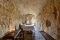 Matera. Sextantio Albergo Diffuso Le grotte della Civita. Interno della Grotta 16 Superior: 45mq, luminosa e dotata di vasca da bagno e toilette. Pavimentazione originale e cisterna d'epoca.