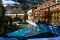 feldmilla.designhotel. Una veduta esterna dell'hotel che si trova nella Valle Aurina.  Solo un piccolo ponte, che attraversa il fiume Aurino, separa la struttura dal centro di Campo Tures.