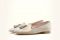 Michele Lopriore. Collezione Spring/Summer 2017. Pantofolina con nappina. Suola in cuoio. Altezza tacco: un centimetro. Tonalità disponibili: tecno bronzo e tecno argento.