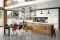 Marchi Cucine. Collezione Gusto Italiano. Il modello Brera 76 infonde, da subito, un’atmosfera “fissuta”. Il top in cemento abbinato al legno vecchio del bancone e il connubio vetro e acciaio, che compongono la struttura pensile, danno vita ad un lifestyle da industrial mood.