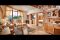 Hotel Quelle Nature Spa Resort. La Suite Royal Dolomites (120mq). Arredata in legno di cirmolo, caminetto spettacolare, bagno con vasca idromassaggio, sauna a raggi infrarossi e balcone panoramico con vista sulla Valle e sulle Dolomiti. La suite dispone di camere da letto separate.