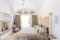 Tenuta del Lauro. Valle d'Itria, Locorotondo. Puglia. Le Suite Trullo, nell’immagine la Suite Roseto, prendono il nome dalle piante presenti nel giardino riservato. Tutte le mattine viene servita la colazione all'ombra di un pergolato di uve.