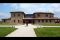 La Bagnaia Golf & Spa Resort Siena, struttura della Curio Collection by Hilton. L'ingresso della Club House del Royal Golf La Bagnaia. 