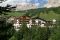 Rosa Alpina Relais & Châteaux. L’Hotel e una veduta del paese di San Cassiano.