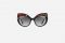 Dolce e Gabbana. Occhiale da sole in acetato dalla forma cat-eye caratterizzato da divertenti scritte e dettagli metallici. Collezione Primavera/Estate 2018. Spring/Summer 2018 Collection.