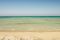 Is Arenas Nature & Charme Resort. La spiaggia, nell’immagine, lunga circa sei chilometri: mare azzurro cristallino, sabbia fine con sfumature rosa e dorate.