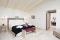 Is Arenas Nature & Charme Resort. Nell’immagine la Suite Super Suite di circa 240 mq. Situata nella Pineta, con ingresso indipendente, ideale per chi è alla ricerca di tranquillità.