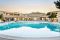 Is Arenas Nature & Charme Resort.Immersa nella pineta, la piscina nell’immagine, è dotata di idromassaggio e servita dal Pool Bar Tradori per gustare a qualsiasi ora vini e specialità sarde.