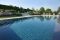 Itaca. Un’altra vista della piscina precedente. In primo piano l’area dedicata al nuoto con bordo a sfioro. Il bacino è stato realizzato in cemento armato dall’impresa Asfalti & Costruzioni. La superficie è di 99 mq. Impianto di trattamento delle acque: filtro a quarzite.