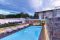 Piscine Castiglione. La villa, una “Casa Passiva” progettata dall’Architetto Francesco Longano è immersa in un ampio spazio verde dove sono collocate una piscina, una minipiscina idromassaggio e un antico agrumeto. Per la realizzazione della piscina con bordo a sfioro, il concessionario Teknopiscine by M&D Group srl, ha utilizzato la tecnologia Myrtha®, fiore all’occhiello di Piscine Castiglione. La vasca - dimensioni  5 x12 metri - è caratterizzata dalla scalinata di accesso con ampio e confortevole prendisole a filo d’acqua, copertura motorizzata a tapparella e sistema automatico di trattamento dell’acqua mentre la pavimentazione circostante è stata realizzata in deck composito.