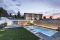 Piscine Castiglione. La villa, una “Casa Passiva” progettata dall’architetto Francesco Longano è immersa in un ampio spazio verde dove sono collocate una piscina, una minipiscina idromassaggio e un antico agrumeto. Per la realizzazione della piscina con bordo a sfioro, il concessionario Teknopiscine by M&D Group srl, ha utilizzato la tecnologia Myrtha®, fiore all’occhiello di Piscine Castiglione. La vasca - dimensioni  5 x12 metri - è caratterizzata dalla scalinata di accesso con ampio e confortevole prendisole a filo d’acqua, copertura motorizzata a tapparella e sistema automatico di trattamento dell’acqua mentre la pavimentazione circostante è stata realizzata in deck composito.