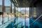 Hotel Terme Merano. La Sky SPA, ospita anche la Infinity Pool, nell’immagine, scoperta e riscaldata (32-34°C) è lunga 22 metri e larga 7.6 metri con accesso interno ed esterno in ogni stagione dell’anno. È dotata di postazioni di micromassaggio.