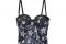 Intimissimi. Top all over di paillettes con motivo a stelle e retro in tulle costruito con coppe in gommina, ferretto e spalline regolabili e removibili.
