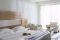 Lefay Resort & SPA Lago di Garda.Letto e zona living della Deluxe Junior Suite. Le stanze (50 mq) si trovano al primo piano e dispongono di un balcone privato.