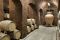 Villa Bibbiani. Il vino invecchia e si affina nell’antica barricaia con volte a vista tra barriques e grossi fusti di rovere francese o di Slovenia o in anfore di terracotta dell’Impruneta o di Cocciopesto. La terracotta lascia che il vino si esprima rispettandone le caratteristiche e l’autenticità mentre il Cocciopesto, in uso dall’epoca romana, grazie alla micro ossigenazione dell’impasto, rende il vino pulito e armonico.