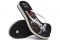 Havaianas. Slim Flatform Cruella. Suola raddoppiata e ispirata al personaggio di Crudelia De Mon, con plantare disegnato e colorato di rosso, bianco e nero. Sottili cinturini bianchi con borchie nere e logo Havaianas in metallo. Prezzo: euro 32,00.