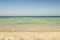 Is Arenas Nature & Charme Resort. La spiaggia, nell’immagine, lunga circa sei chilometri: mare azzurro cristallino, sabbia fine con sfumature rosa e dorate.