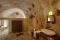 Matera. Sextantio Albergo Diffuso Le grotte della Civita. Il bagno all'interno della Grotta 6 Superior: pavimentazione irregolare e due antiche cisterne caratterizzano l'ambiente.